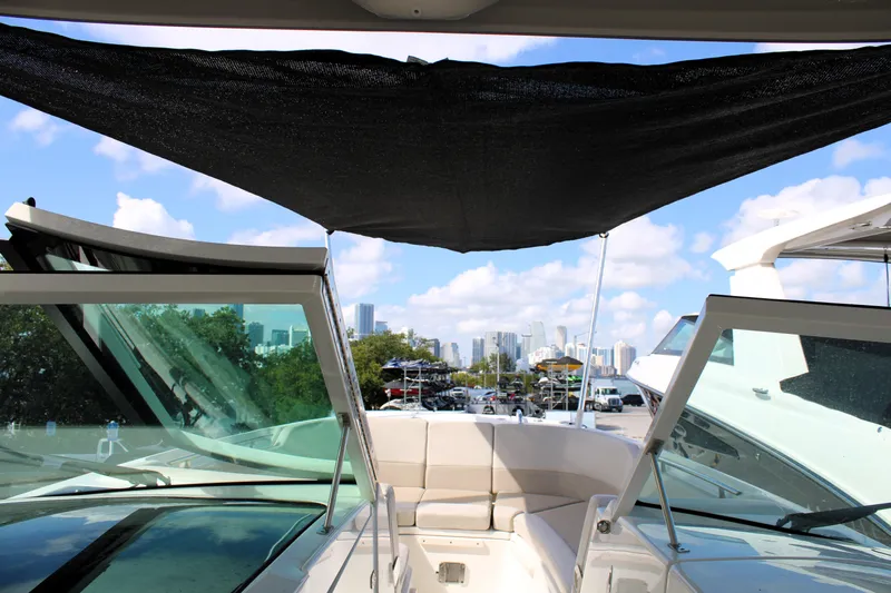 Yacht Photos Pics 2021 Boston Whaler 320 Vantage boat interior with city skyline view.