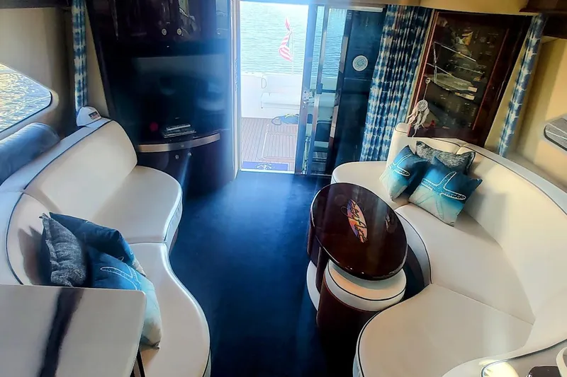  Yacht Photos Pics Luxurious interior of 2007 Sea Ray 58 Sedan Bridge yacht with elegant seating and decor.