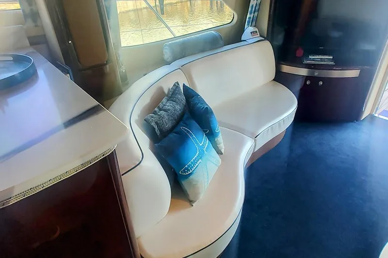  Yacht Photos Pics Luxurious interior of 2007 Sea Ray 58 Sedan Bridge with elegant seating and decor.