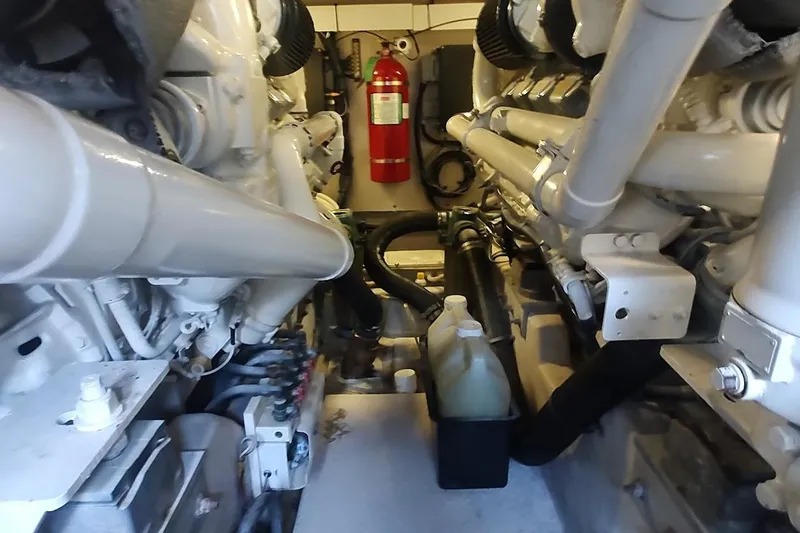 Yacht Photos Pics Engine room of a 2007 Sea Ray 58 Sedan Bridge with visible machinery and fire extinguisher.