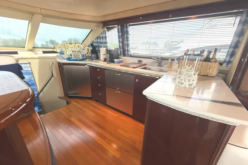  Yacht Photos Pics Luxurious interior of 2007 Sea Ray 58 Sedan Bridge yacht with elegant kitchen design.