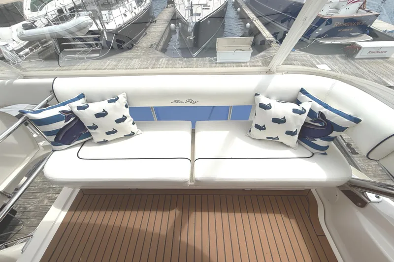  Yacht Photos Pics Luxurious 2007 Sea Ray 58 Sedan Bridge yacht with stylish seating and nautical-themed cushions.