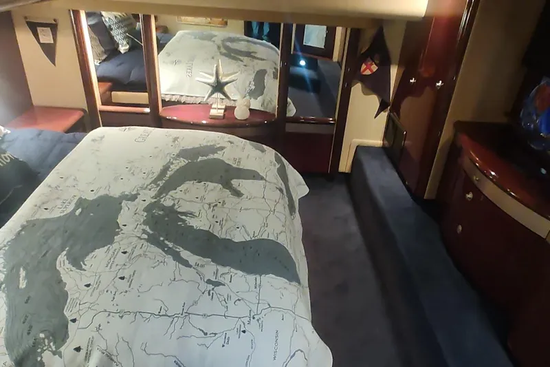  Yacht Photos Pics Luxurious 2007 Sea Ray 58 Sedan Bridge bedroom with nautical-themed decor.