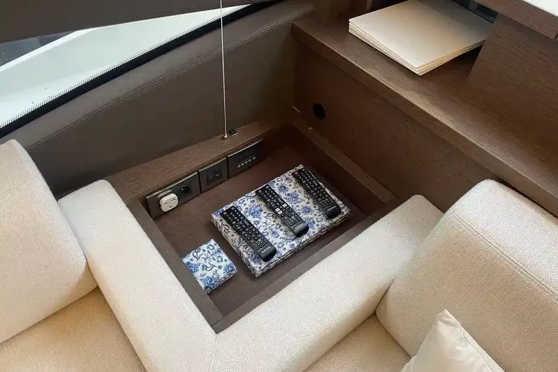  Yacht Photos Pics Luxury yacht interior with remote controls and outlets, Prestige 520, 2020 model.