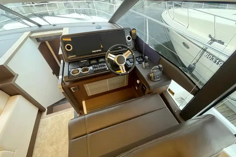  Yacht Photos Pics 2020 Prestige 520 yacht helm with modern controls and panoramic view.