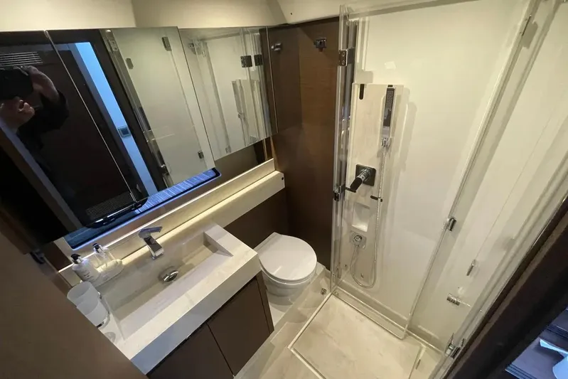  Yacht Photos Pics Luxurious bathroom in 2020 Prestige 520 yacht with modern fixtures and glass shower.