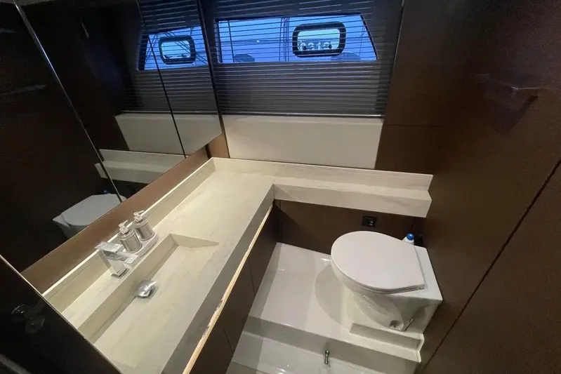  Yacht Photos Pics Luxurious bathroom in 2020 Prestige 520 yacht with modern fixtures and sleek design.