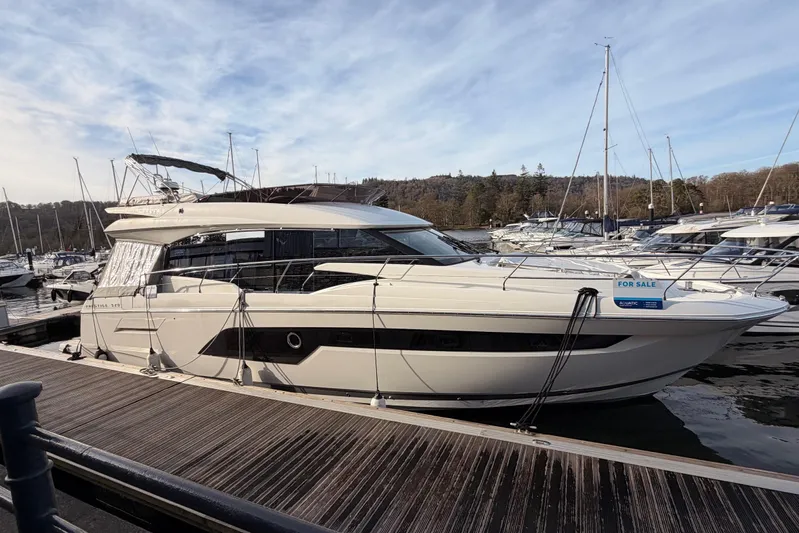  Yacht Photos Pics Luxury 2020 Prestige 520 yacht docked, for sale, under clear skies.