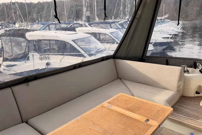  Yacht Photos Pics Cozy interior of 2020 Prestige 520 yacht with marina view.