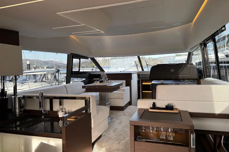  Yacht Photos Pics Luxurious interior of a 2020 Prestige 520 yacht with modern furnishings and panoramic windows.