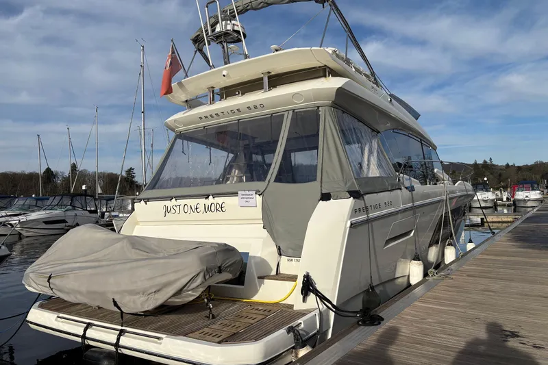  Yacht Photos Pics Luxury 2020 Prestige 520 yacht docked at marina under clear sky.