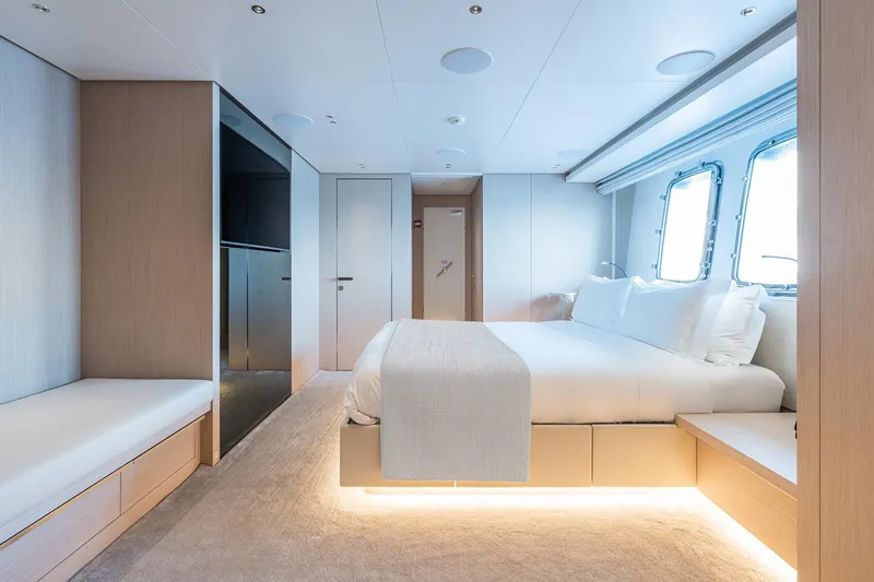Ami Yacht Photos Pics Luxurious bedroom interior of 2023 Sanlorenzo SX112 yacht with modern design and ambient lighting.