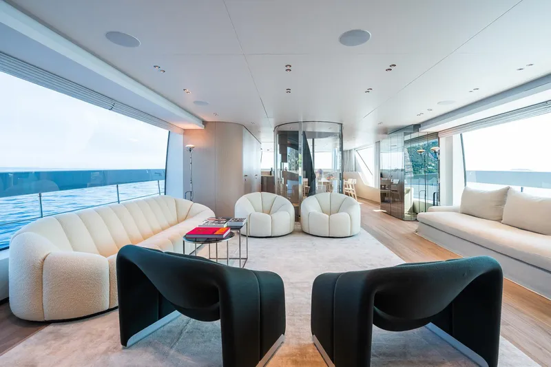 Ami Yacht Photos Pics Luxurious interior of 2023 Sanlorenzo SX112 yacht with modern seating and ocean view.