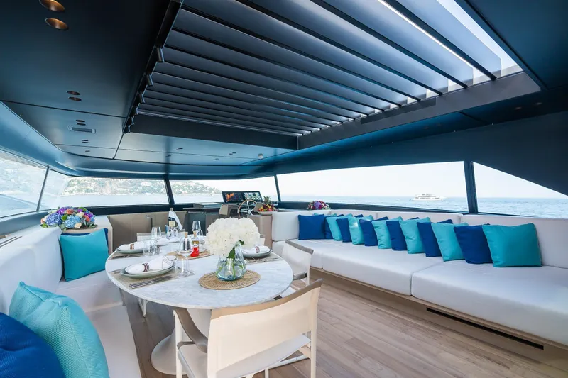 Ami Yacht Photos Pics Luxurious interior of 2023 Sanlorenzo SX112 yacht with elegant dining area and panoramic views.