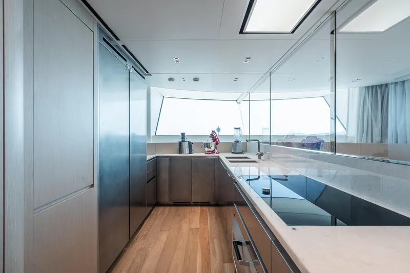 Ami Yacht Photos Pics Modern kitchen interior on 2023 Sanlorenzo SX112 yacht, featuring sleek design and ample natural light.