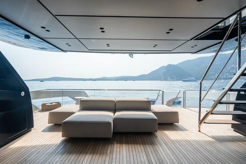 Ami Yacht Photos Pics Luxurious 2023 Sanlorenzo SX112 yacht deck with modern seating and scenic ocean view.
