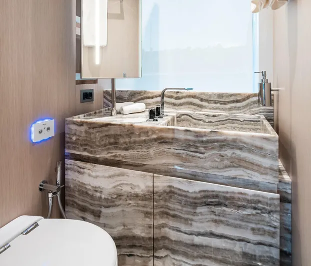 Ami Yacht Photos Pics Luxurious bathroom in 2023 Sanlorenzo SX112 yacht with elegant marble sink and modern fixtures.