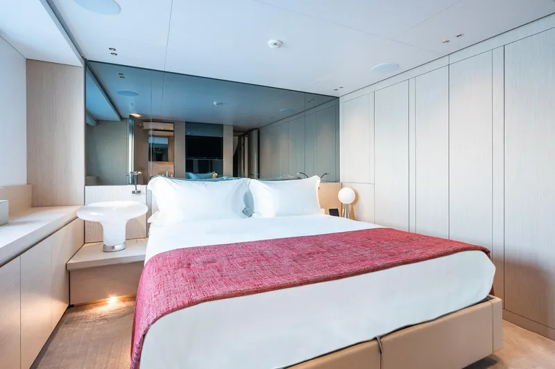 Ami Yacht Photos Pics Luxurious bedroom interior on 2023 Sanlorenzo SX112 yacht with modern design and elegant decor.