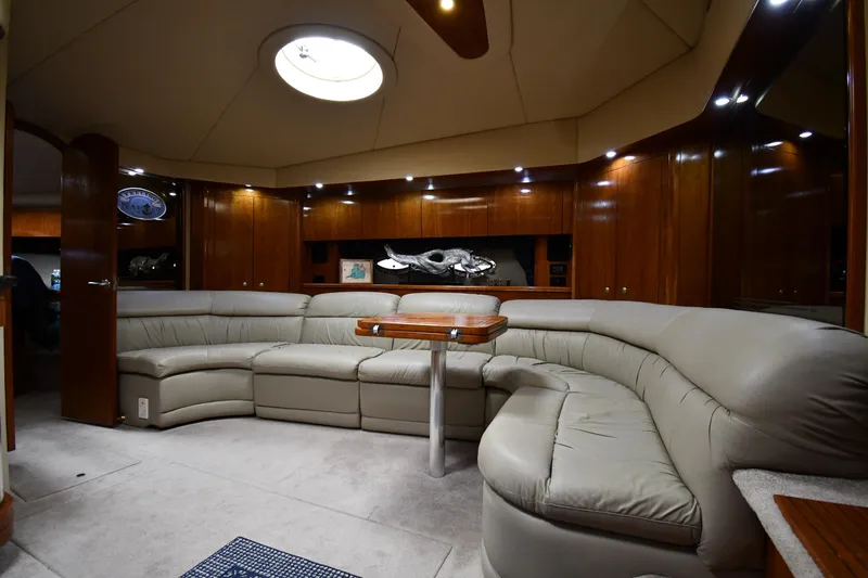 This Is It Yacht Photos Pics Luxurious interior of 2005 Cruisers Yachts 520 Express with leather seating and wooden accents.