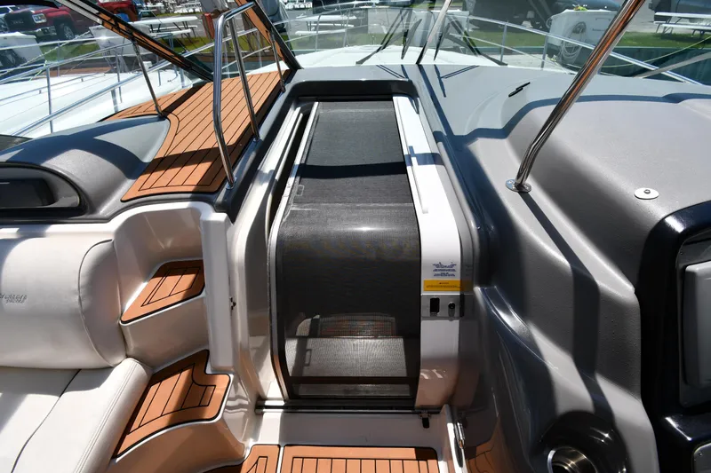 This Is It Yacht Photos Pics 2005 Cruisers Yachts 520 Express cockpit with teak flooring and sliding door.