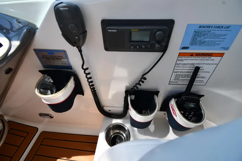 This Is It Yacht Photos Pics Control panel of 2005 Cruisers Yachts 520 Express with radio and communication devices.