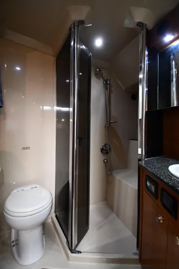 This Is It Yacht Photos Pics 2005 Cruisers Yachts 520 Express bathroom with shower and toilet.