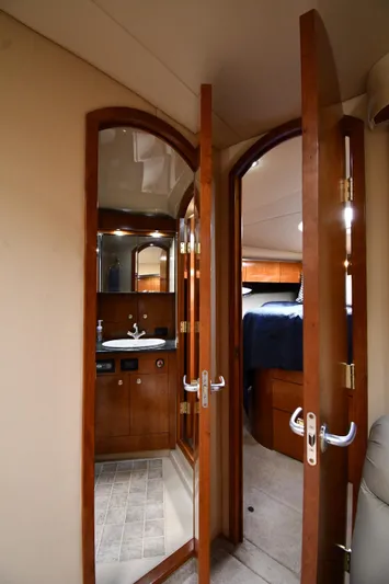 This Is It Yacht Photos Pics 2005 Cruisers Yachts 520 Express interior with bathroom and bedroom view.