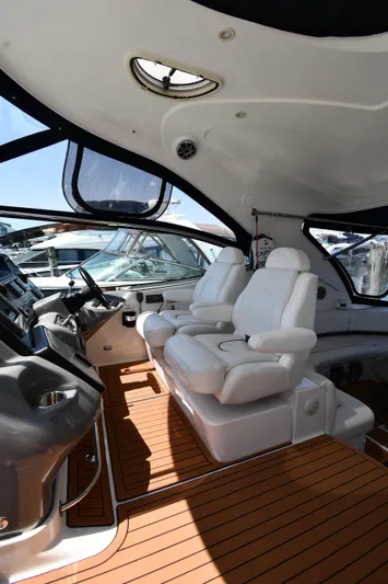 This Is It Yacht Photos Pics Interior of a 2005 Cruisers Yachts 520 Express with white leather seats.