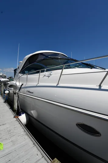 This Is It Yacht Photos Pics 2005 Cruisers Yachts 520 Express docked under a clear blue sky.