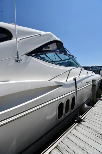 This Is It Yacht Photos Pics 2005 Cruisers Yachts 520 Express docked under clear blue sky.