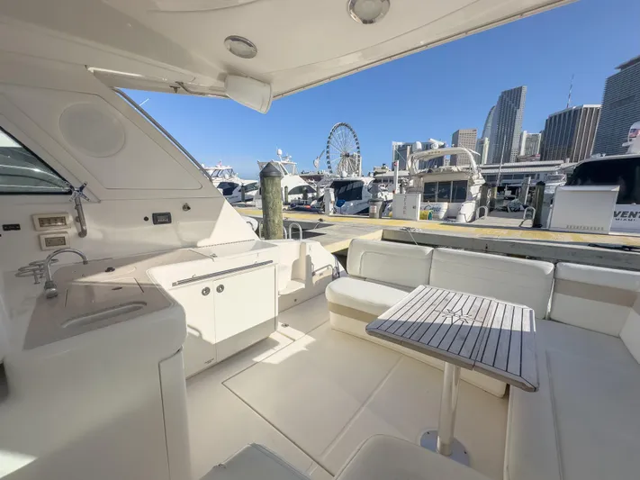 Yacht Photos Pics 2010 Sea Ray 450 Sundancer yacht interior with city skyline and Ferris wheel in the background.