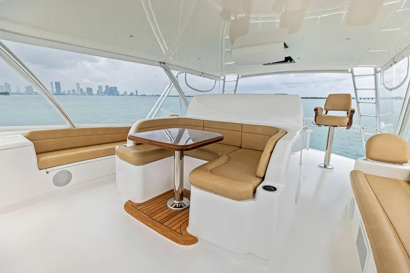 Mvp Yacht Photos Pics 2018 Viking 80 Convertible yacht interior with seating and table, ocean view.