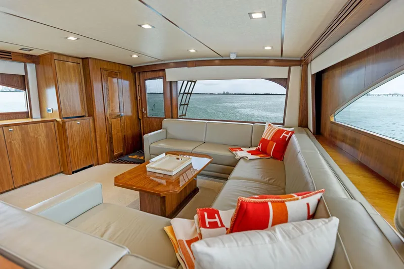 Mvp Yacht Photos Pics Luxurious interior of 2018 Viking 80 Convertible yacht with spacious seating and ocean view.