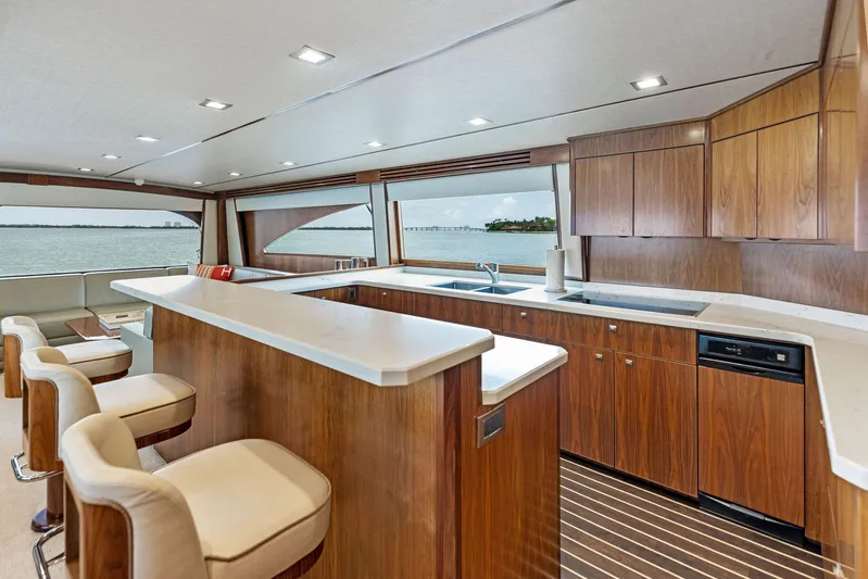Mvp Yacht Photos Pics Luxurious kitchen area on a 2018 Viking 80 Convertible yacht with ocean view.