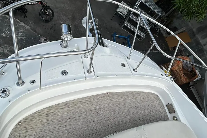  Yacht Photos Pics 2020 Sea Ray Sundancer 320 boat deck with stainless steel railings and wood-textured flooring.