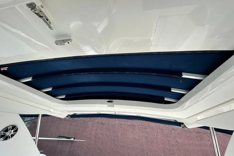  Yacht Photos Pics 2020 Sea Ray Sundancer 320 boat canopy with blue fabric and white frame.