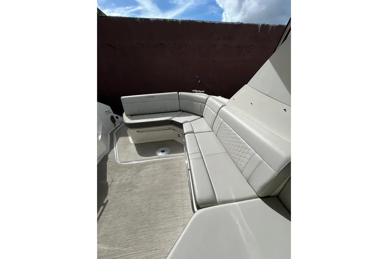  Yacht Photos Pics 2020 Sea Ray Sundancer 320 boat interior with beige seating and modern design.