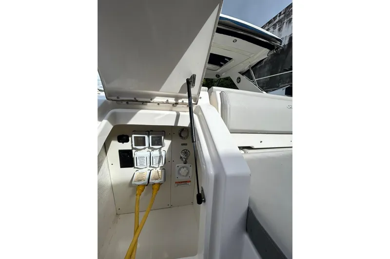  Yacht Photos Pics 2020 Sea Ray Sundancer 320 electrical panel with open hatch and visible wiring.