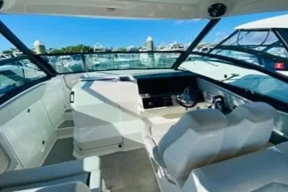  Yacht Photos Pics 2020 Sea Ray Sundancer 320 boat interior with modern seating and dashboard.