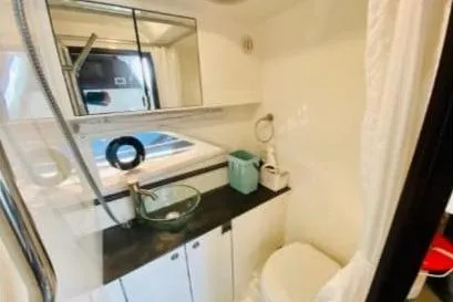  Yacht Photos Pics 2020 Sea Ray Sundancer 320 bathroom with modern fixtures and sleek design.