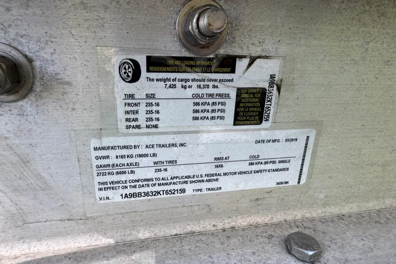 Yacht Photos Pics Label on a 2007 Yellowfin 34 Offshore trailer, detailing tire and weight specifications.