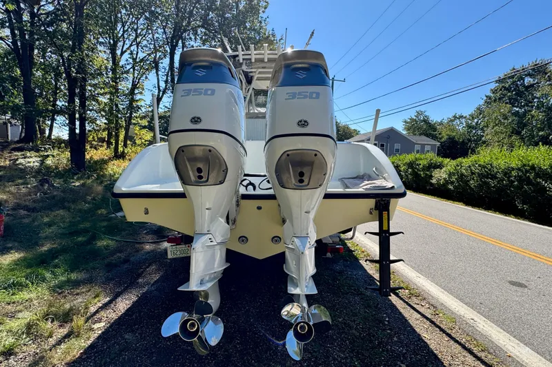  Yacht Photos Pics 2007 Yellowfin 34 Offshore boat with dual 350 horsepower engines, parked roadside.