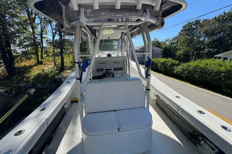  Yacht Photos Pics 2007 Yellowfin 34 Offshore boat interior with helm and seating, parked on a sunny street.