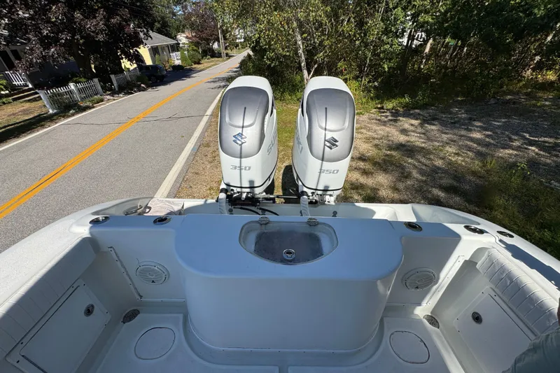  Yacht Photos Pics 2007 Yellowfin 34 Offshore boat with dual Suzuki 350 engines on a road.