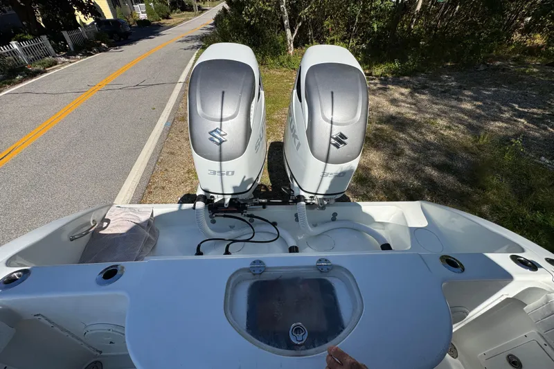  Yacht Photos Pics 2007 Yellowfin 34 Offshore boat with dual Suzuki 350 engines, parked roadside.