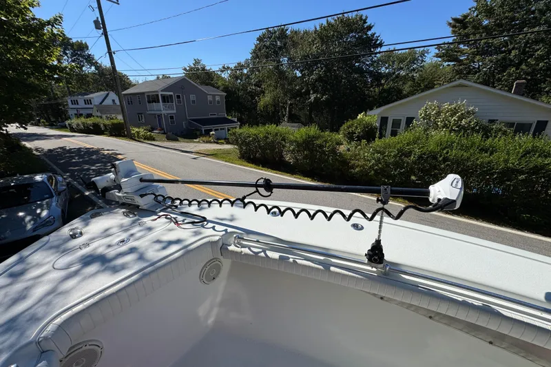  Yacht Photos Pics 2007 Yellowfin 34 Offshore boat with trolling motor on a sunny street.