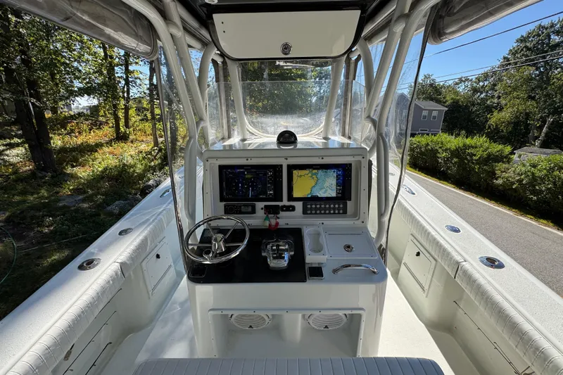  Yacht Photos Pics 2007 Yellowfin 34 Offshore boat cockpit with navigation screens and steering wheel.