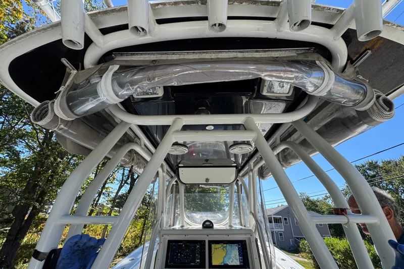  Yacht Photos Pics 2007 Yellowfin 34 Offshore boat interior with navigation equipment and rod holders.