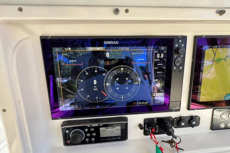  Yacht Photos Pics Simrad navigation display on 2007 Yellowfin 34 Offshore boat dashboard.