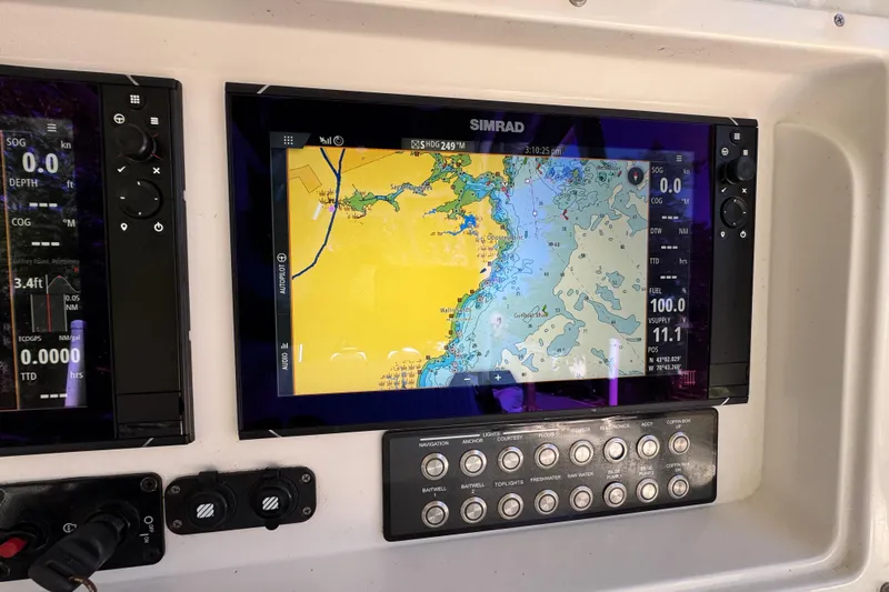  Yacht Photos Pics Simrad navigation display on 2007 Yellowfin 34 Offshore boat dashboard.